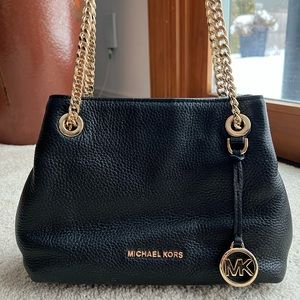 Michael Kors slouchy black purse with gold chain strap. Used in great condition!